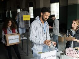 Volunteers organizing donation supplies at a local nonprofit event to support community outreach and charitable efforts.