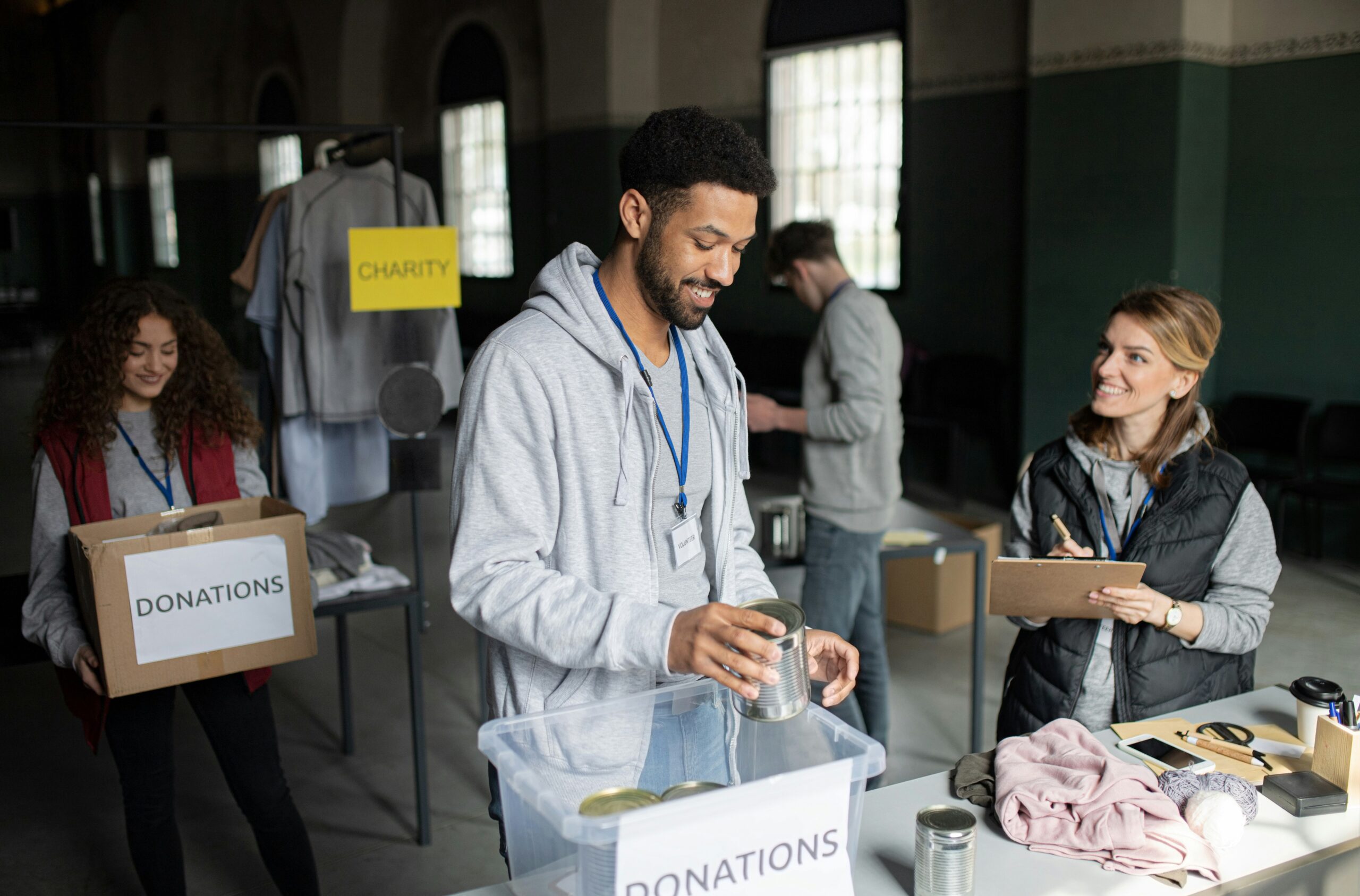 Volunteers organizing donation supplies at a local nonprofit event to support community outreach and charitable efforts.